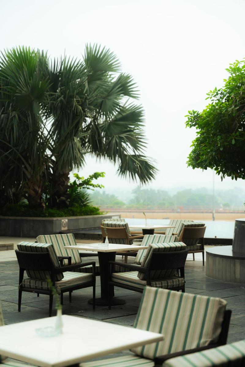 a row of tables and chairs on a patio at JW Marriott Hotel Kolkata in Kolkata