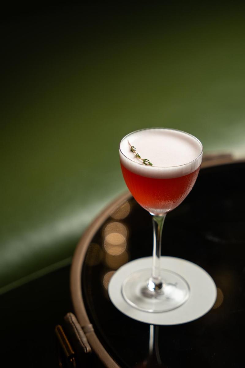a wine glass sitting on top of a table at JW Marriott Hotel Kolkata in Kolkata