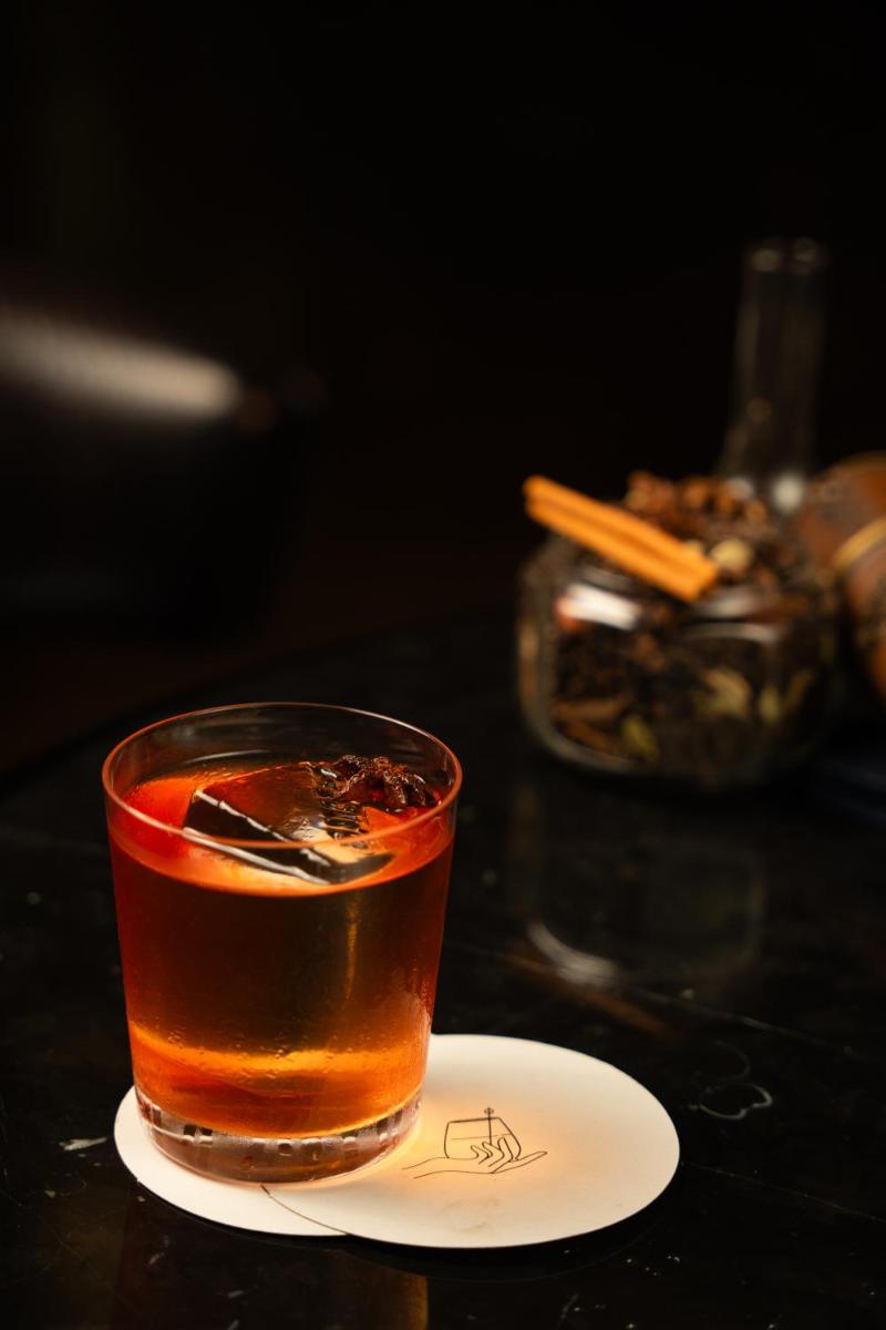 a cup of tea on a plate on a table at JW Marriott Hotel Kolkata in Kolkata