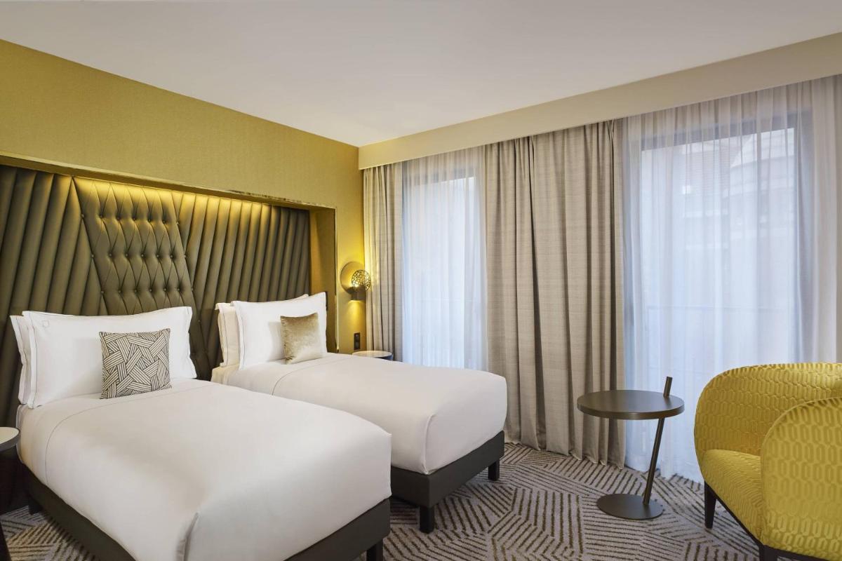 Un ou plusieurs lits dans un hébergement de l'établissement La Caserne Chanzy Hotel & Spa, Autograph Collection