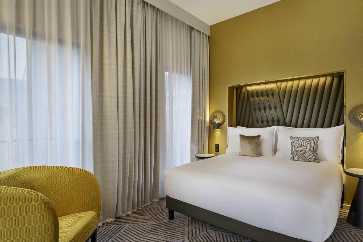 Un ou plusieurs lits dans un hébergement de l'établissement La Caserne Chanzy Hotel & Spa, Autograph Collection