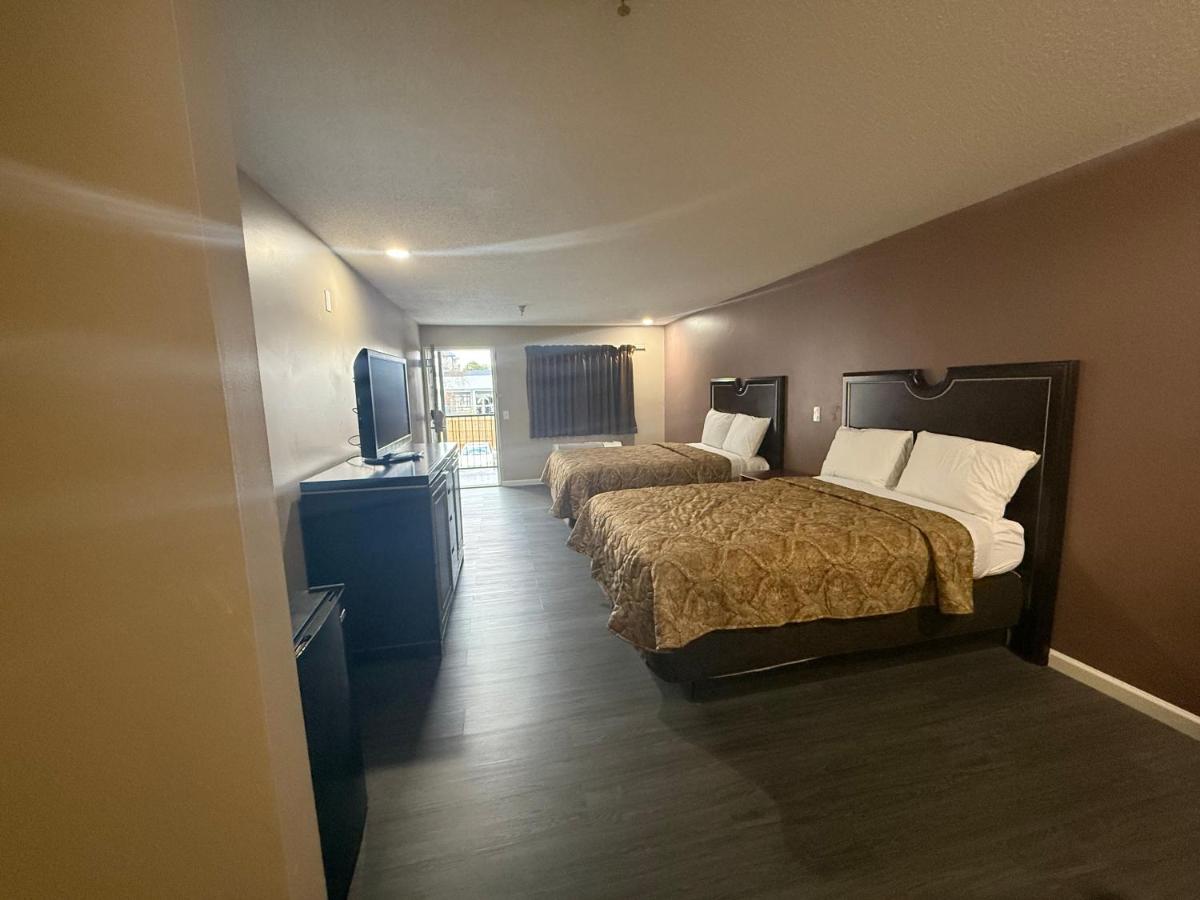 Magnolia Bay Hotel & Suites - Housity