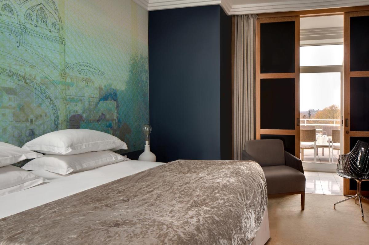Un ou plusieurs lits dans un hébergement de l'établissement Célestins Spa Thermal & Hôtel by Vy Resort