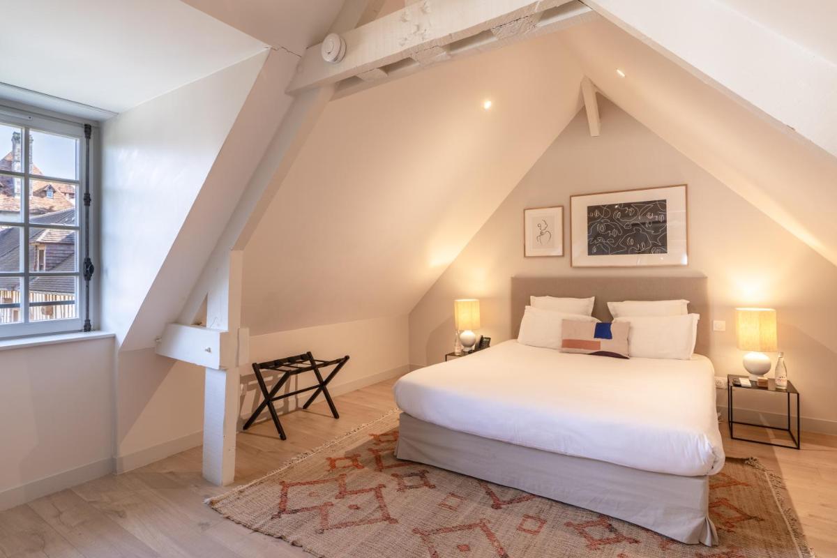 Un ou plusieurs lits dans un hébergement de l'établissement Les Manoirs des Portes de Deauville - Small Luxury Hotel Of The World