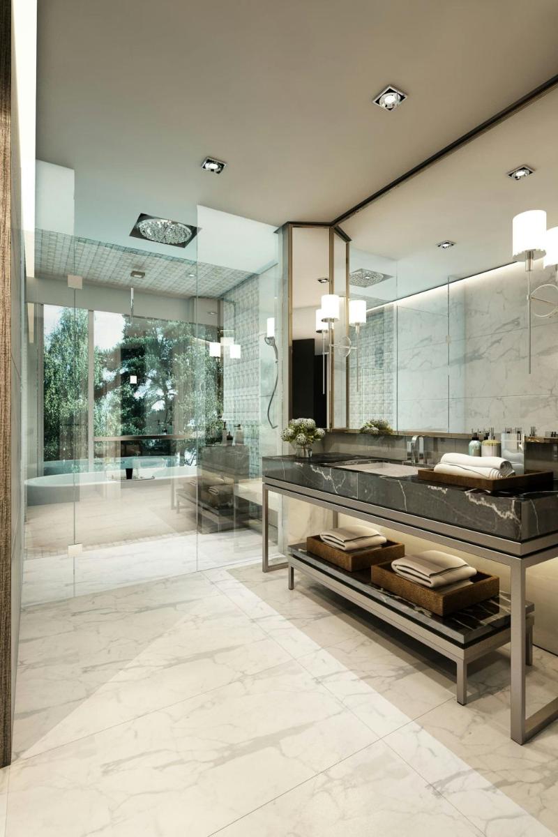 a bathroom with a sink and a large mirror at JW Marriott Hotel Kolkata in Kolkata