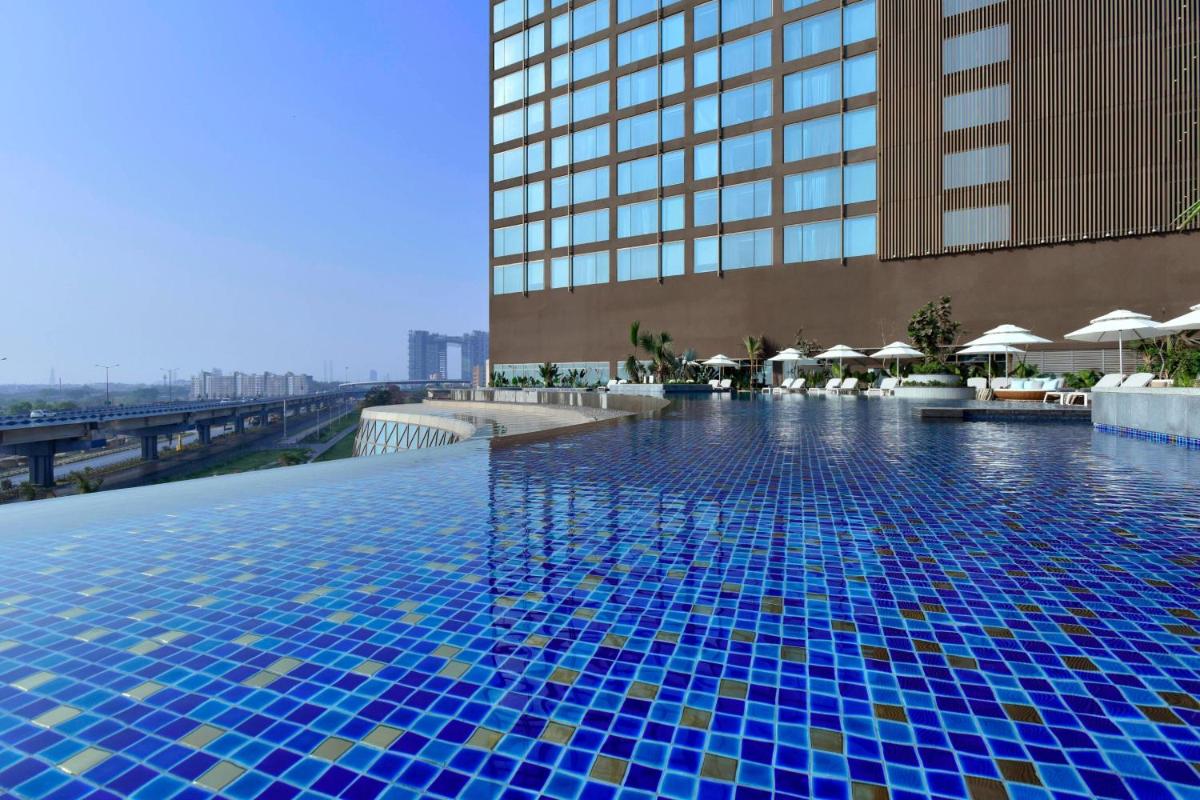 a swimming pool on the roof of a building at JW Marriott Hotel Kolkata in Kolkata