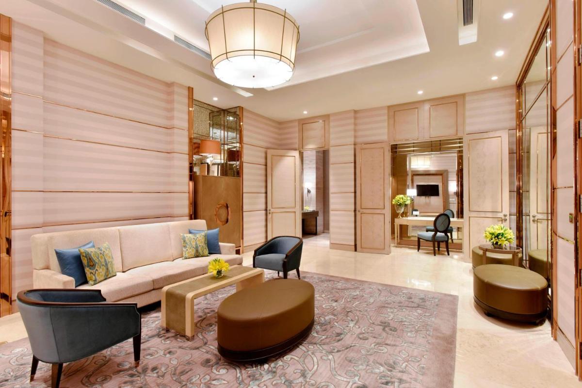 a living room with a couch and a table at JW Marriott Hotel Kolkata in Kolkata