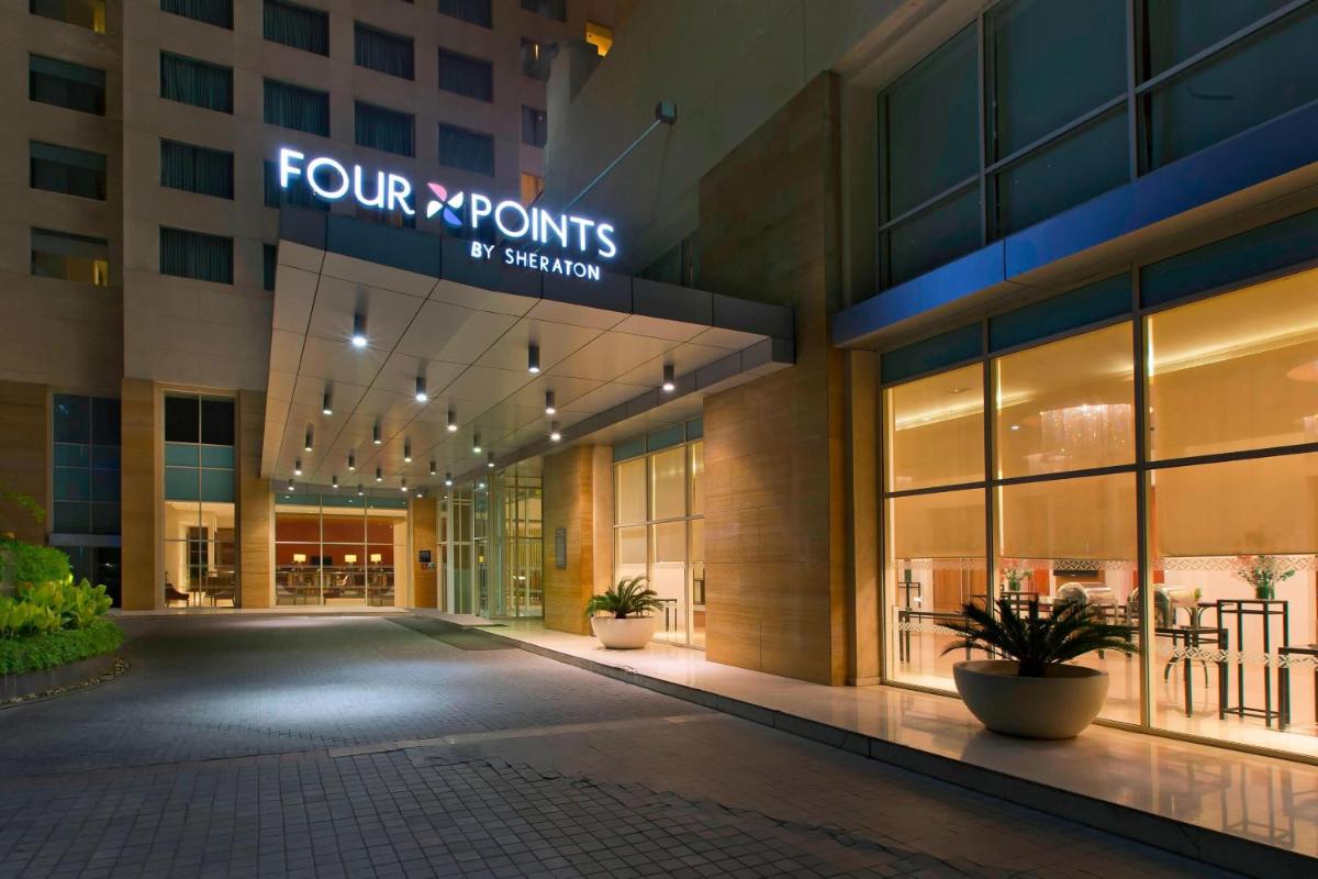 a view of the front of a fourxpoints building at Four Points by Sheraton Hotel and Serviced Apartments Pune in Pune