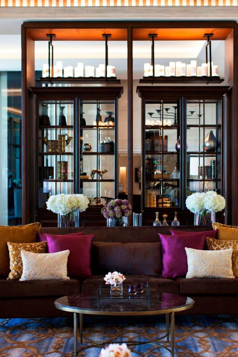 a living room with a couch and a table at JW Marriott Mussoorie Walnut Grove Resort & Spa in Mussoorie