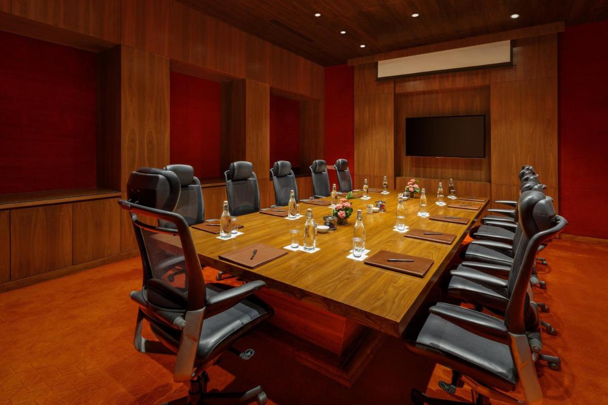 a large conference room with a long table and chairs at ITC Sonar, a Luxury Collection Hotel, Kolkata in Kolkata