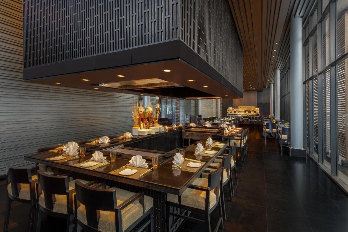 a dining room with a long table and chairs at ITC Sonar, a Luxury Collection Hotel, Kolkata in Kolkata