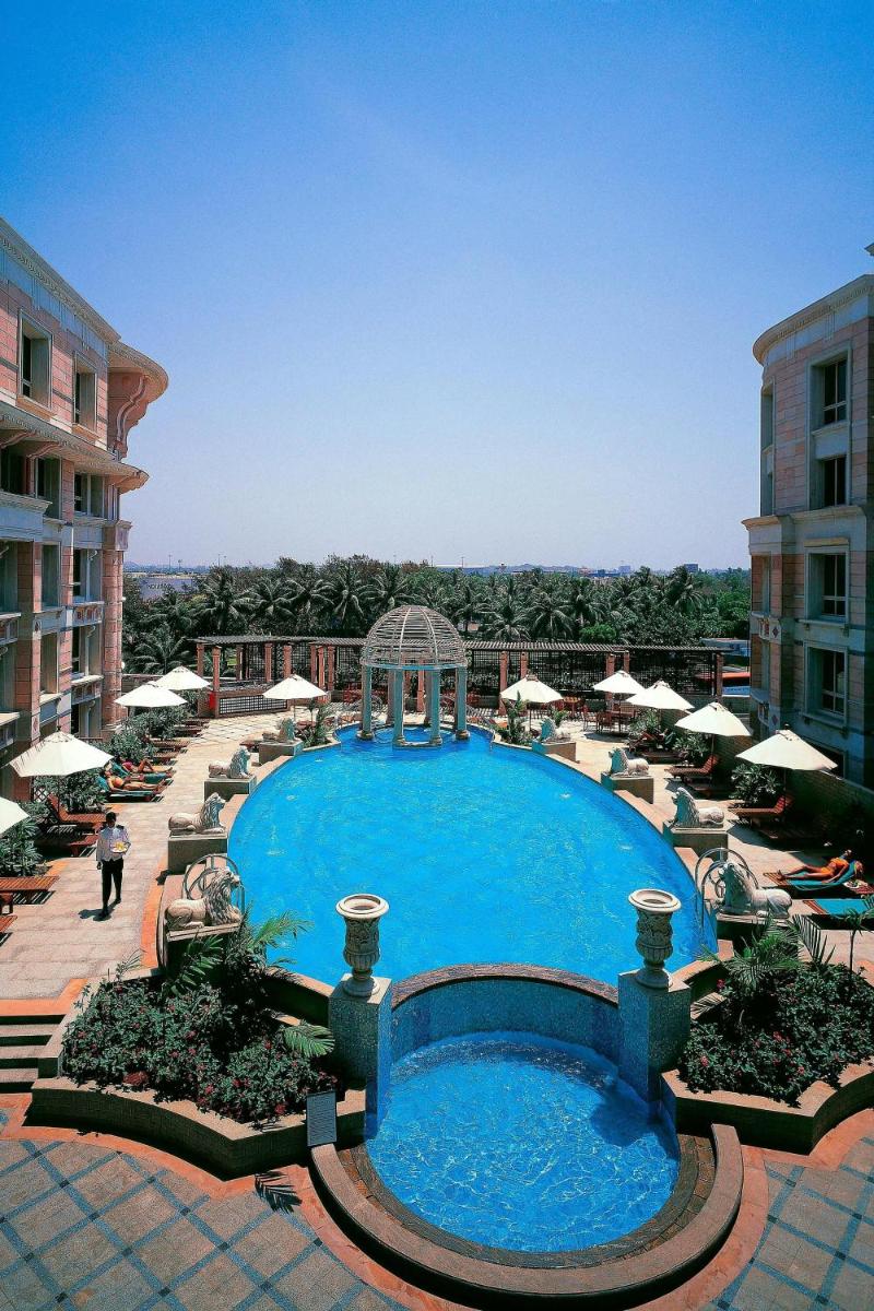 a large pool with a gazebo next to a building at ITC Maratha, a Luxury Collection Hotel, Mumbai in Mumbai