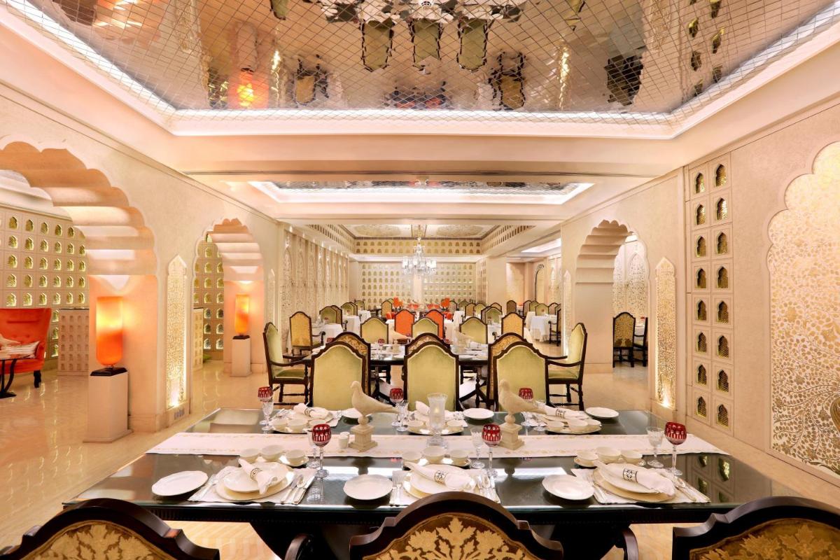 a large dining room with a large table and chairs at ITC Maratha, a Luxury Collection Hotel, Mumbai in Mumbai