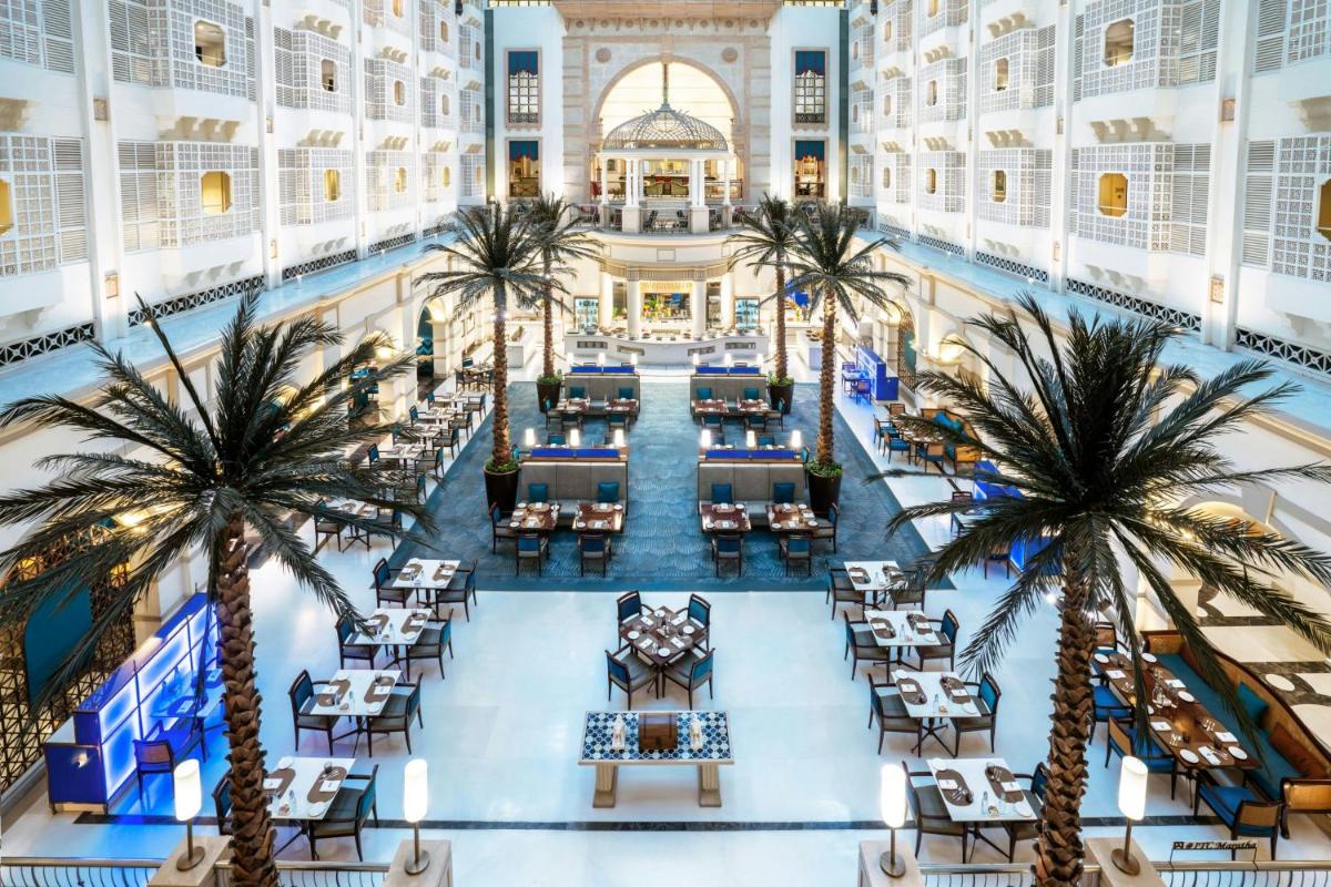 an overhead view of the lobby of a hotel with palm trees at ITC Maratha, a Luxury Collection Hotel, Mumbai in Mumbai an overhead view of the lobby of a hotel with palm trees at ITC Maratha, a Luxury Collection Hotel, Mumbai in Mumbai