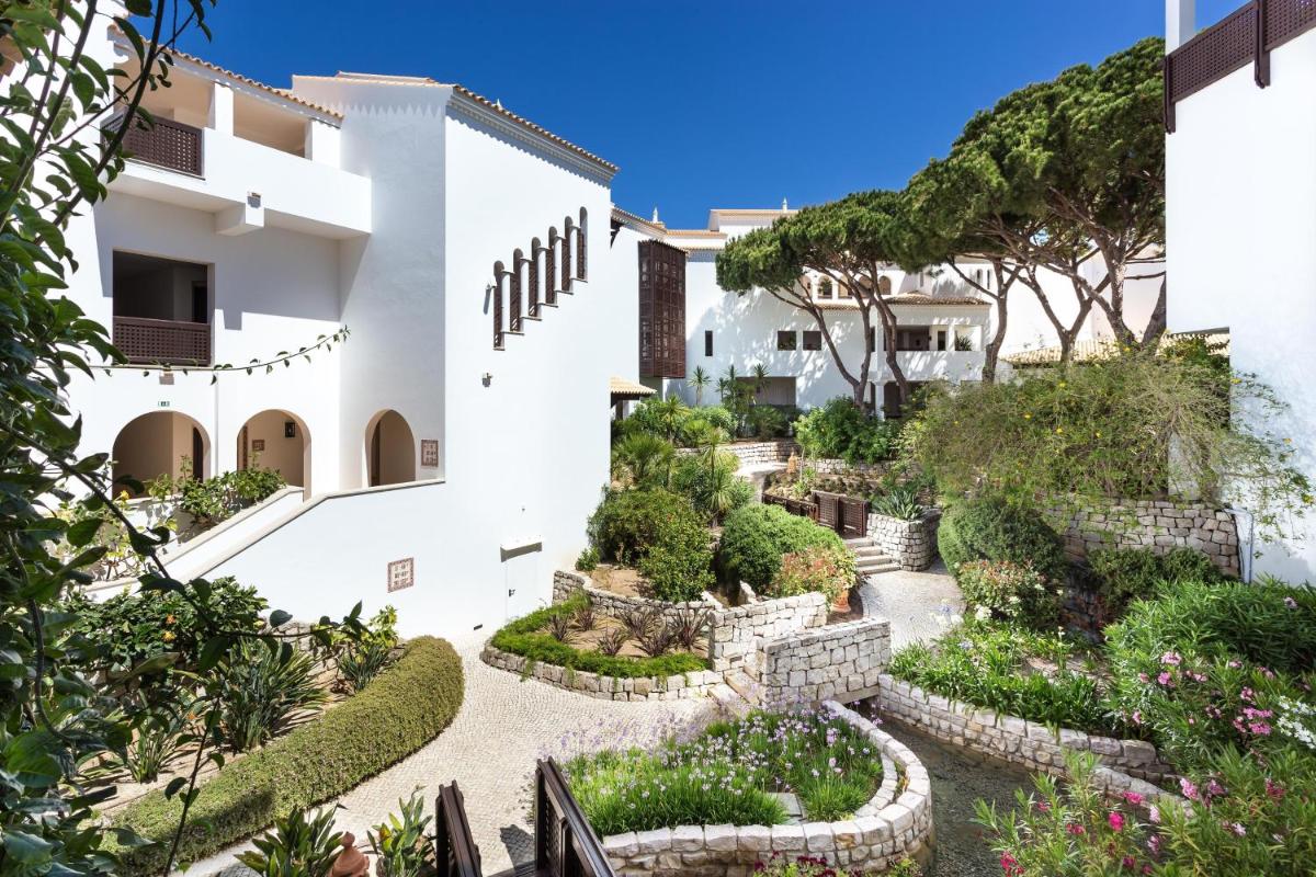 uma vista exterior de uma casa com um jardim em Pine Cliffs Hotel, a Luxury Collection Resort, Algarve em Albufeira