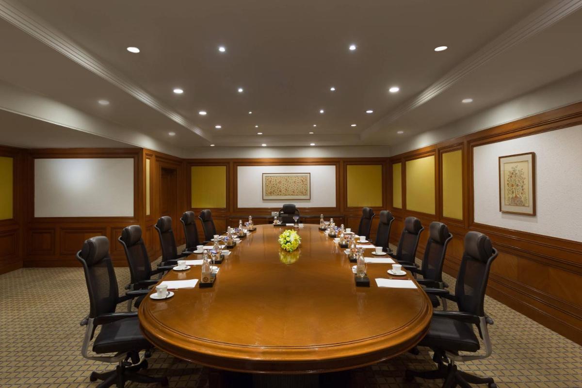 a large conference room with a long table and chairs at ITC Kakatiya, a Luxury Collection Hotel, Hyderabad in Hyderabad