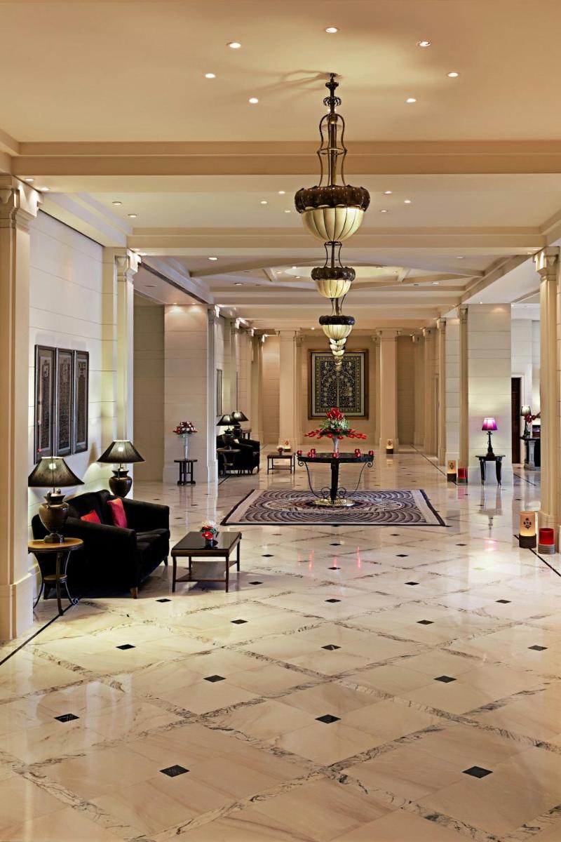 a lobby with a chandelier and a living room at ITC Kakatiya, a Luxury Collection Hotel, Hyderabad in Hyderabad