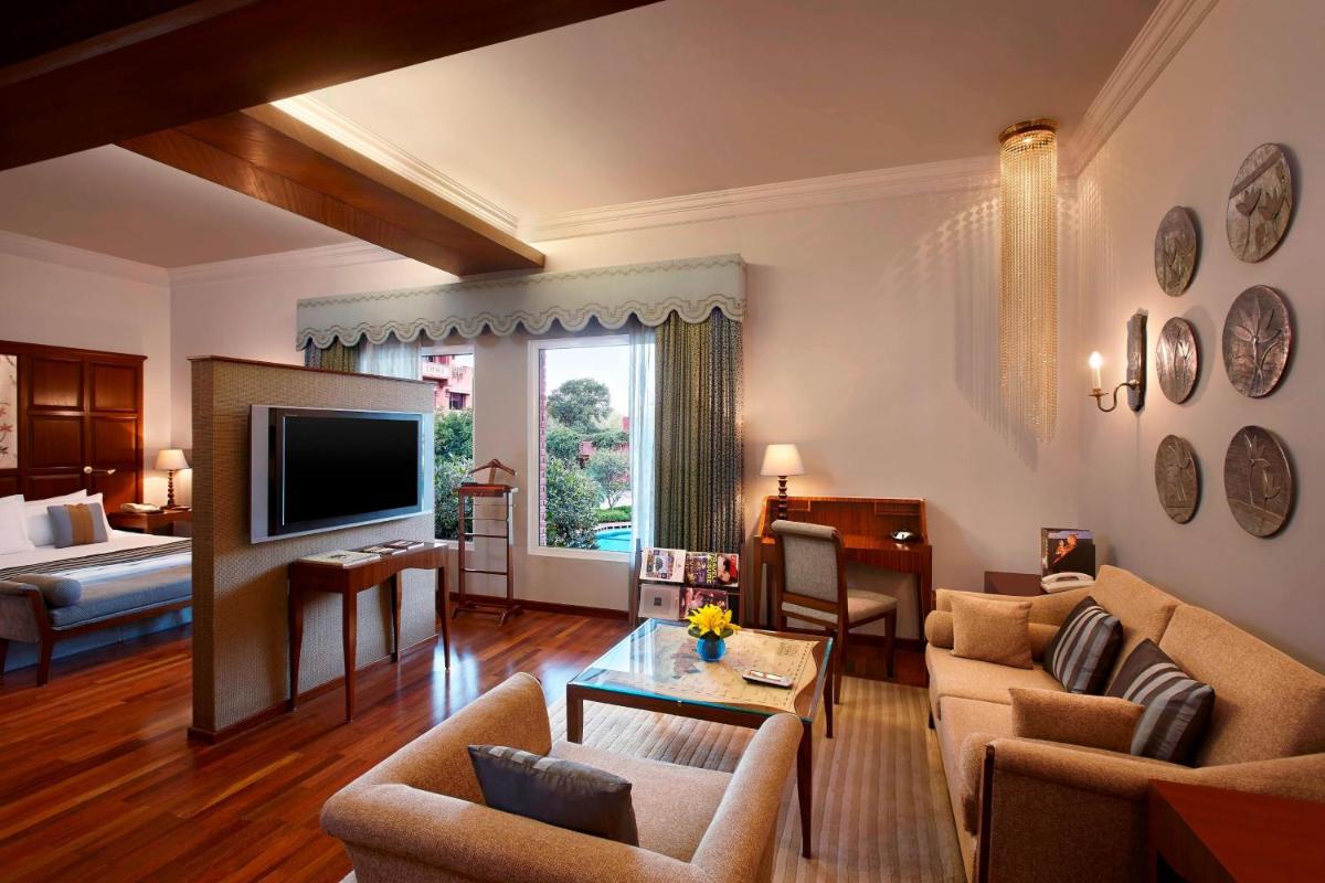 a living room with a couch and a television at ITC Rajputana, a Luxury Collection Hotel, Jaipur in Jaipur