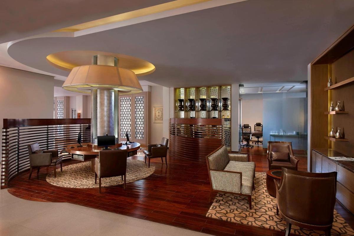 a lobby with a dining room with a table and chairs at ITC Rajputana, a Luxury Collection Hotel, Jaipur in Jaipur