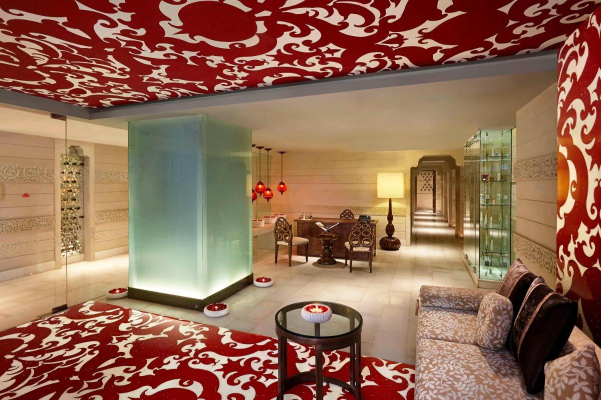 a living room with a couch and a table at ITC Rajputana, a Luxury Collection Hotel, Jaipur in Jaipur