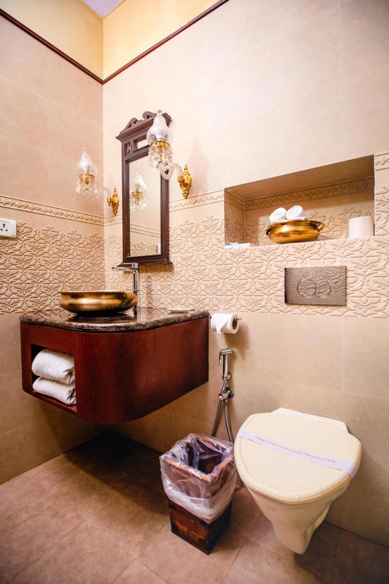 a bathroom with a sink and a toilet in it at The Grand Imperial - Heritage Hotel in Agra