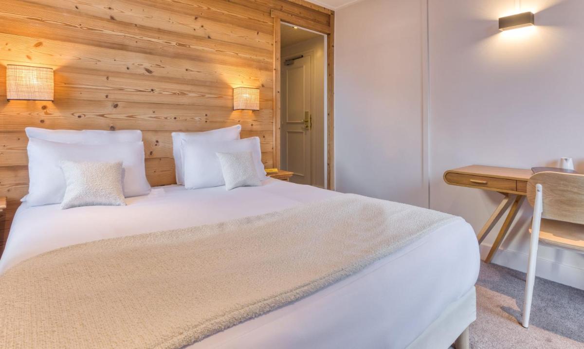 Un ou plusieurs lits dans un hébergement de l'établissement Hôtel Lyret