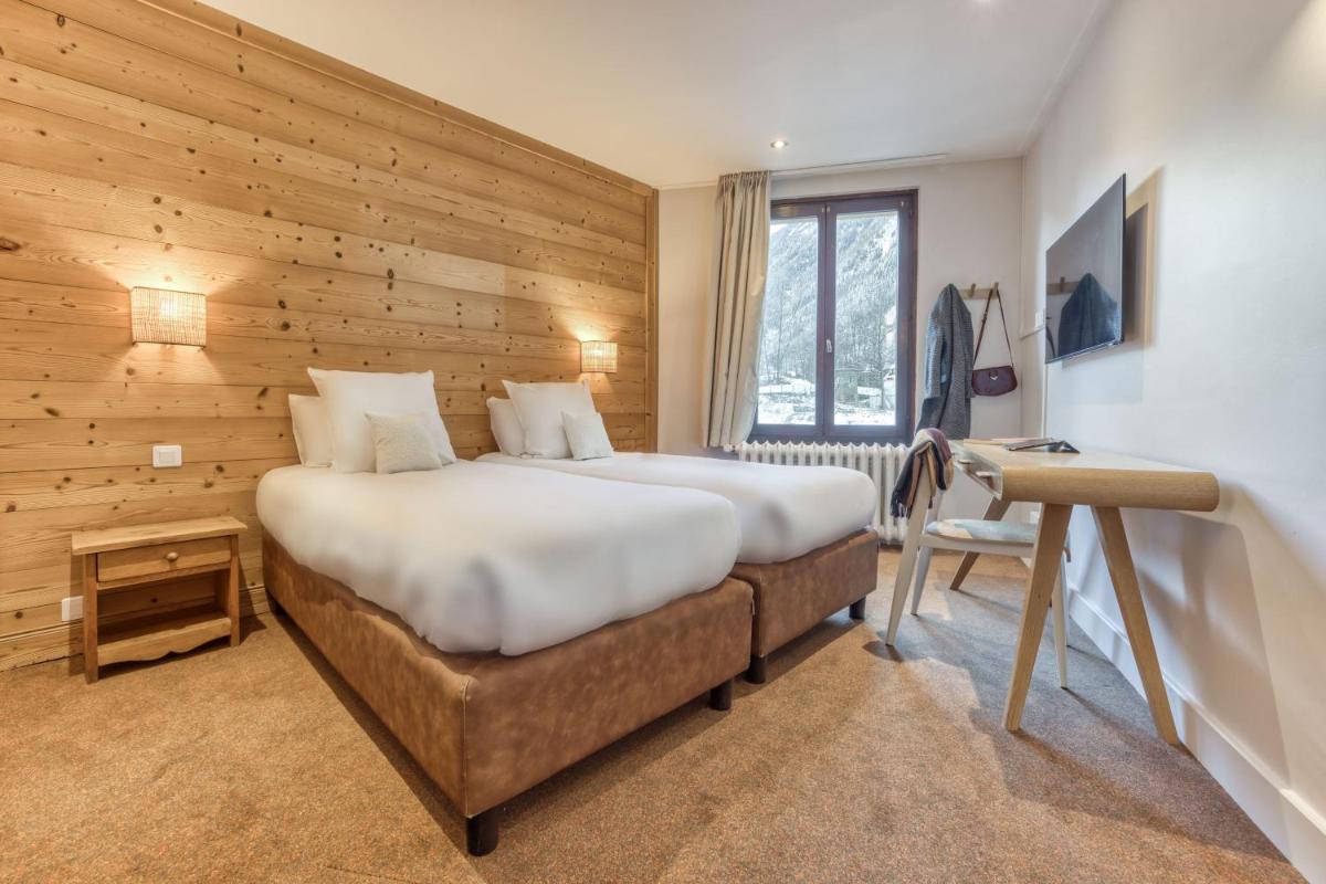 Un ou plusieurs lits dans un hébergement de l'établissement Hôtel Lyret