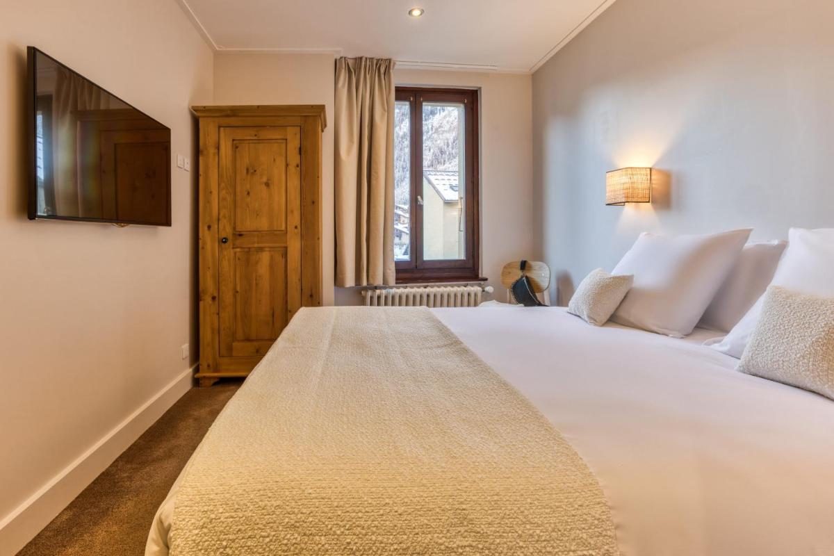 Un ou plusieurs lits dans un hébergement de l'établissement Hôtel Lyret