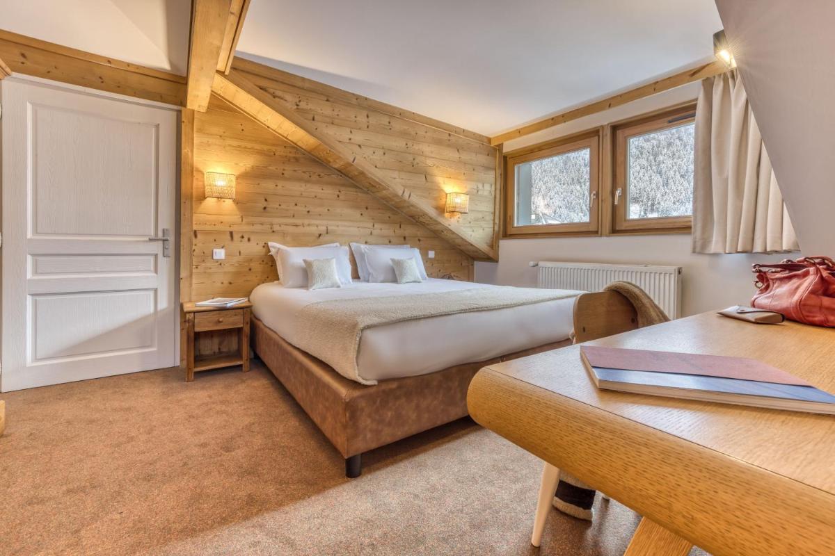 Un ou plusieurs lits dans un hébergement de l'établissement Hôtel Lyret