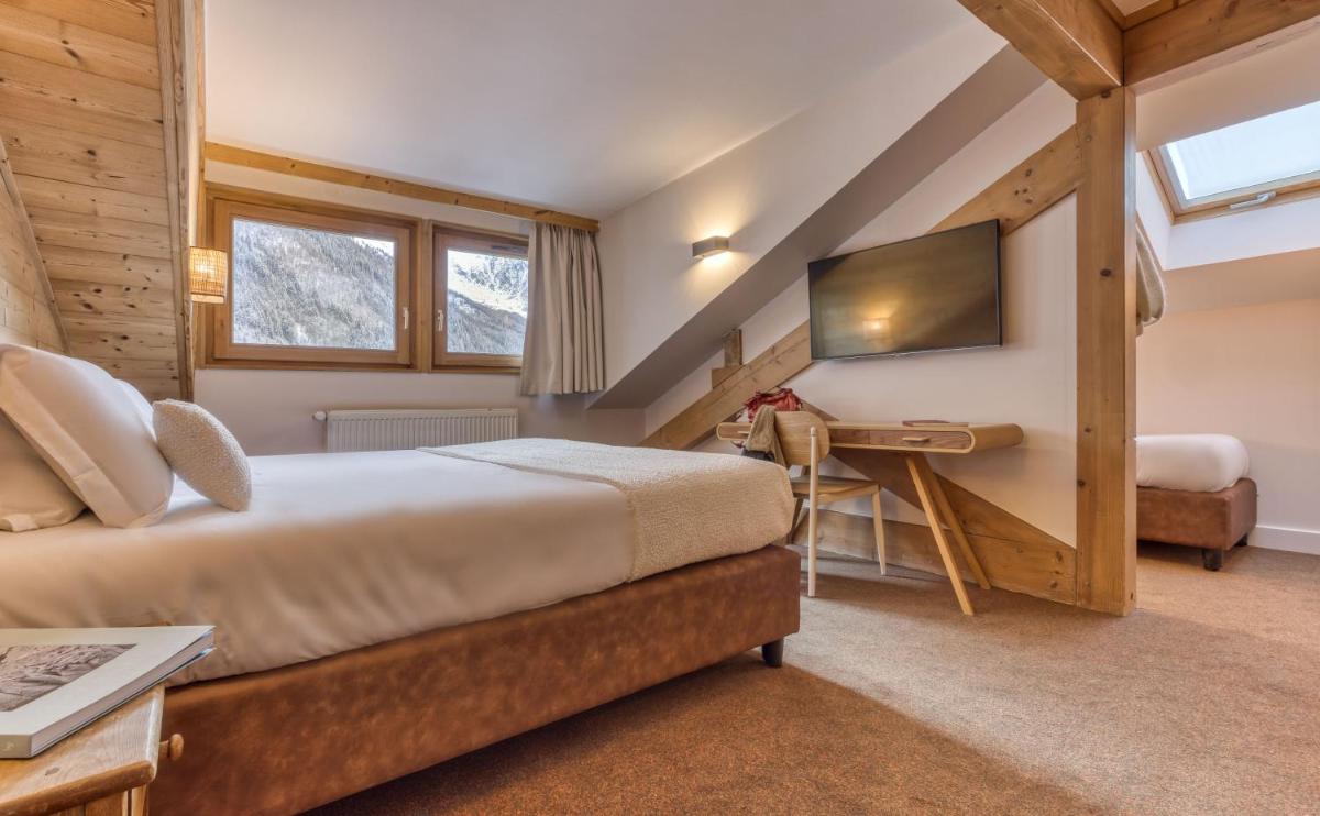 Un ou plusieurs lits dans un hébergement de l'établissement Hôtel Lyret