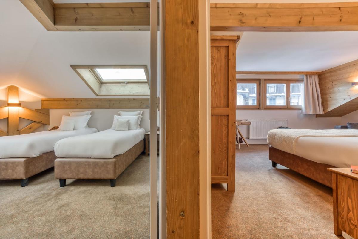 Un ou plusieurs lits dans un hébergement de l'établissement Hôtel Lyret