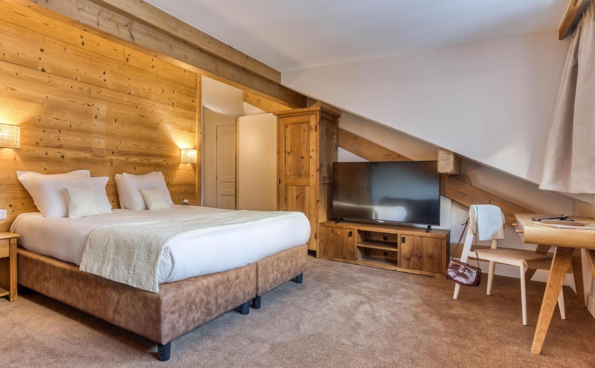 Un ou plusieurs lits dans un hébergement de l'établissement Hôtel Lyret