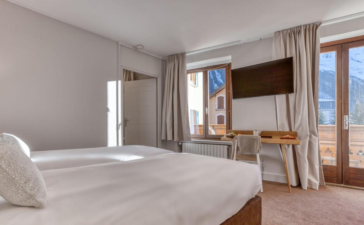 Télévision ou salle de divertissement dans l'établissement Hôtel Lyret