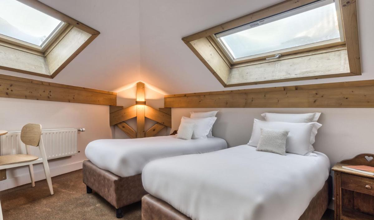Un ou plusieurs lits dans un hébergement de l'établissement Hôtel Lyret