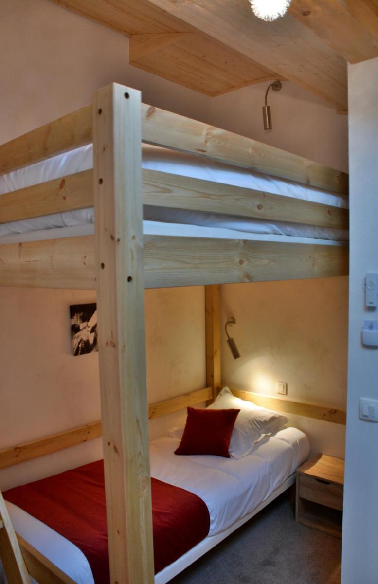Un ou plusieurs lits dans un hébergement de l'établissement Hôtel Les Côtes, Résidence Loisirs et Chalets