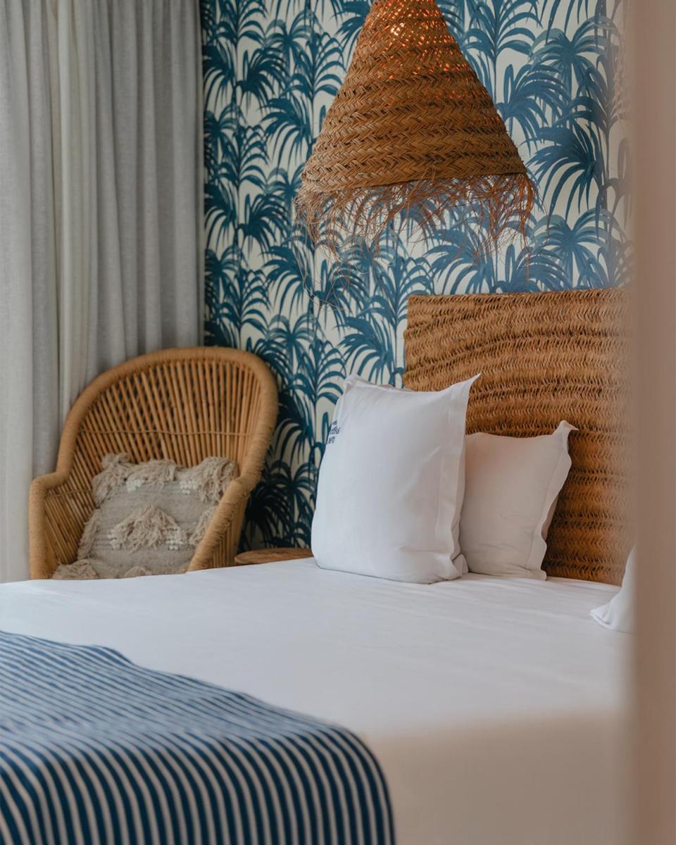 Un ou plusieurs lits dans un hébergement de l'établissement Les Bulles de Mer - Hotel & Spa sur la Plage