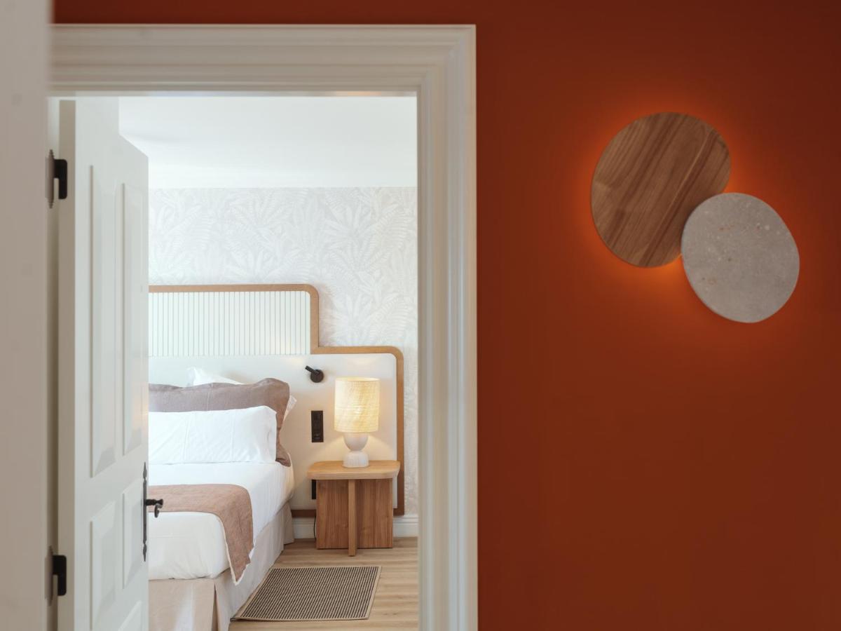 Uma cama ou camas num quarto em Dreams Madeira Resort Spa & Marina