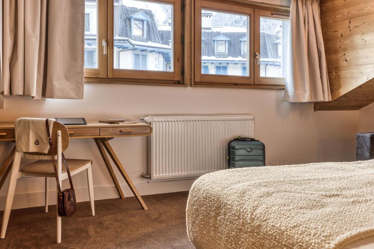 Un ou plusieurs lits dans un hébergement de l'établissement Hôtel Lyret
