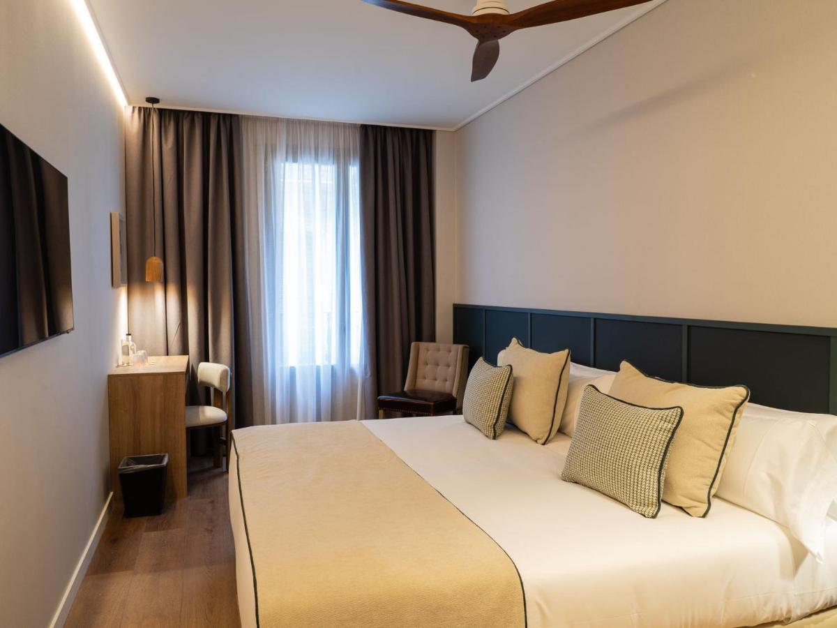 Cama o camas de una habitación en Hotel Well and Come Málaga