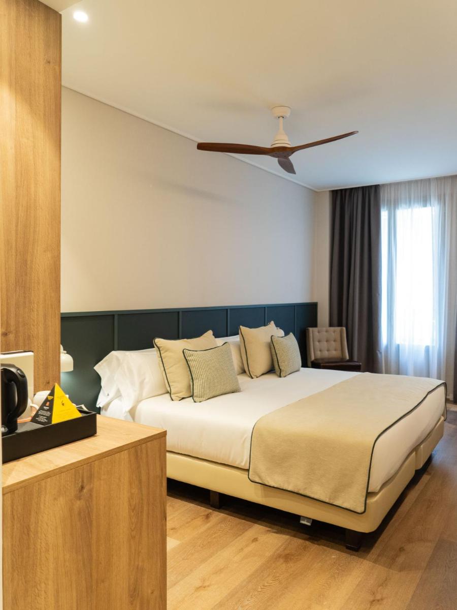 Cama o camas de una habitación en Hotel Well and Come Málaga