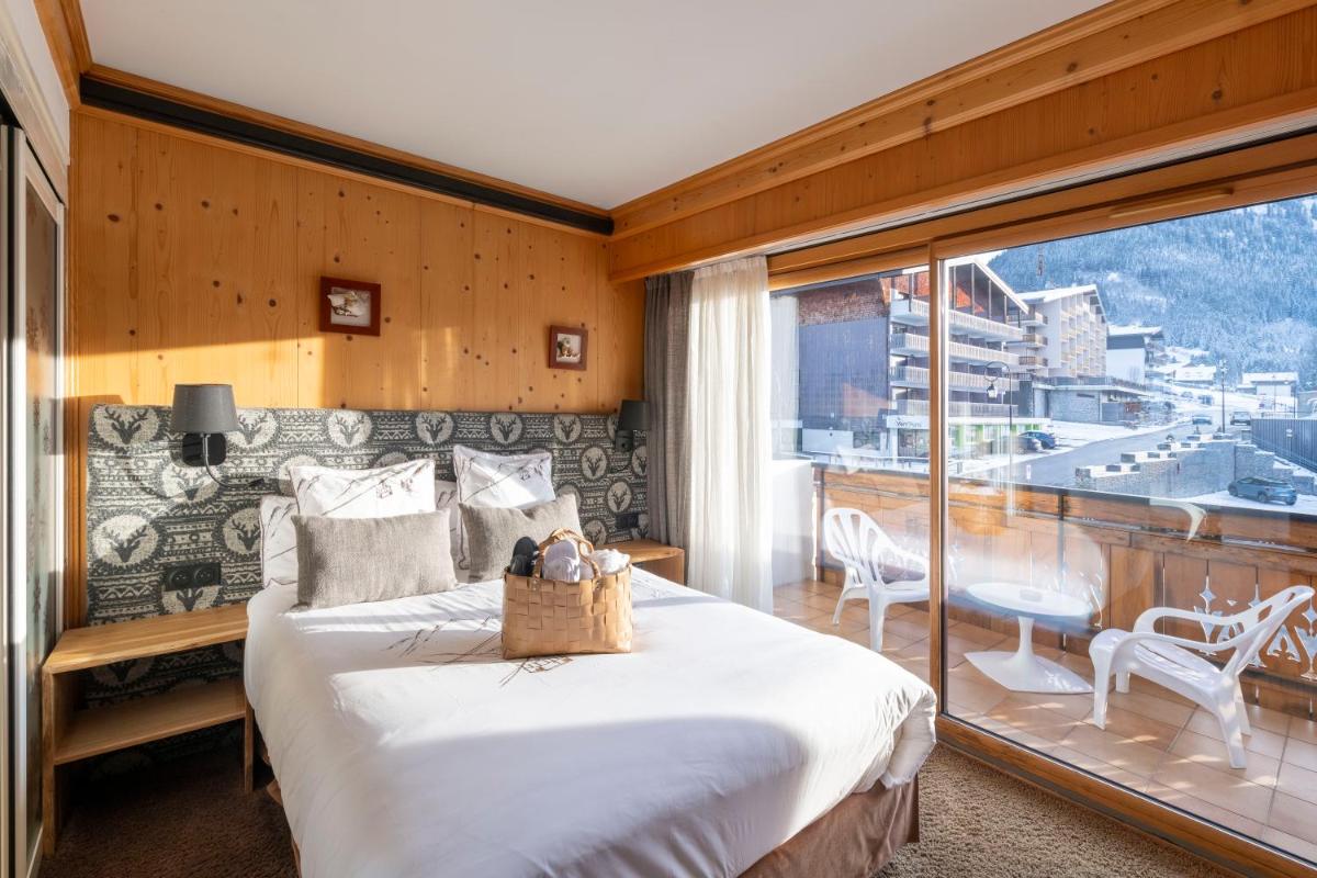 Un ou plusieurs lits dans un hébergement de l'établissement Hôtel Macchi Restaurant & Spa