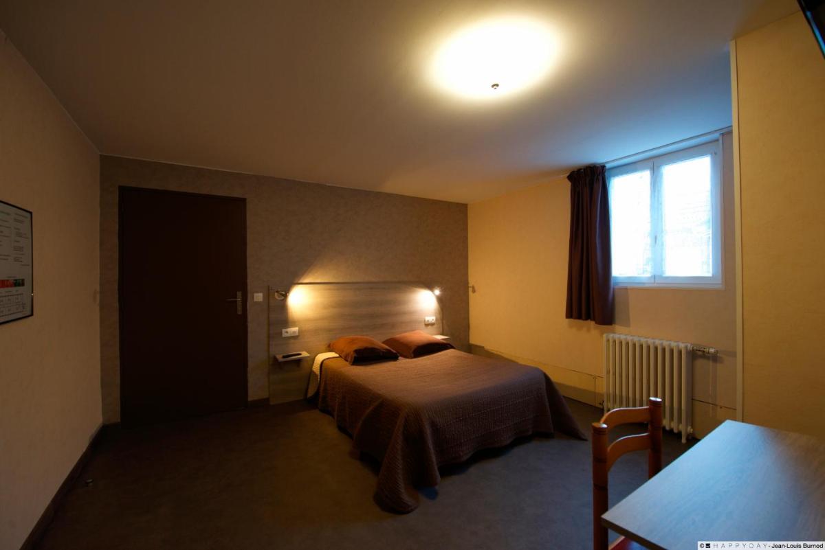 Un ou plusieurs lits dans un hébergement de l'établissement Hôtel La Tente Verte