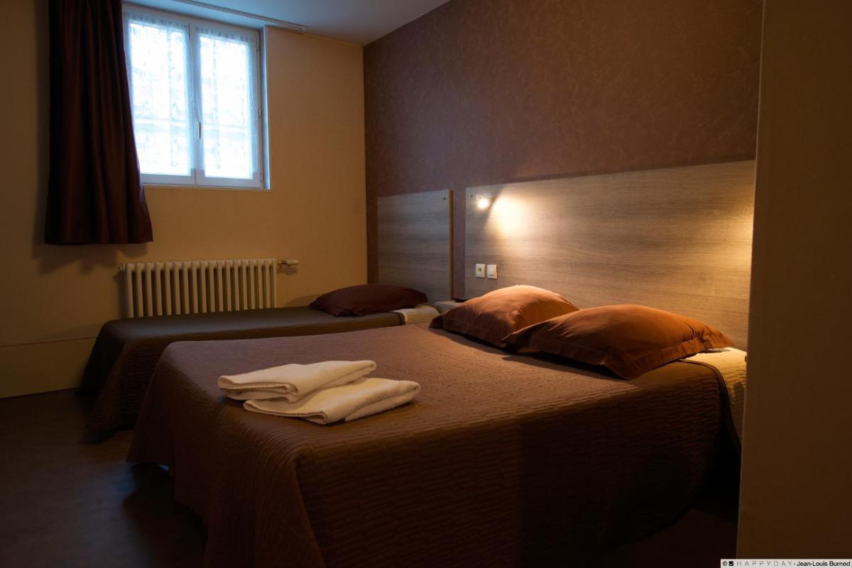 Un ou plusieurs lits dans un hébergement de l'établissement Hôtel La Tente Verte