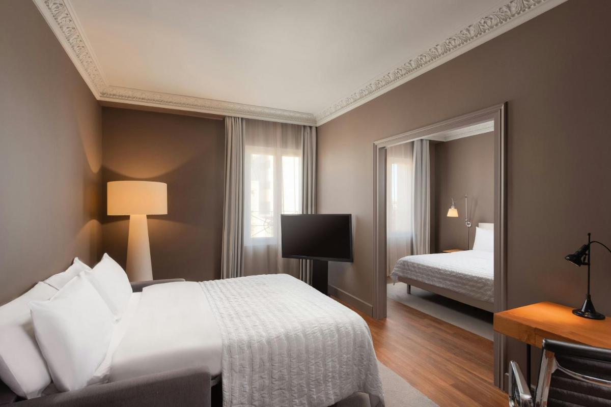 Cama o camas de una habitación en Le Meridien Barcelona