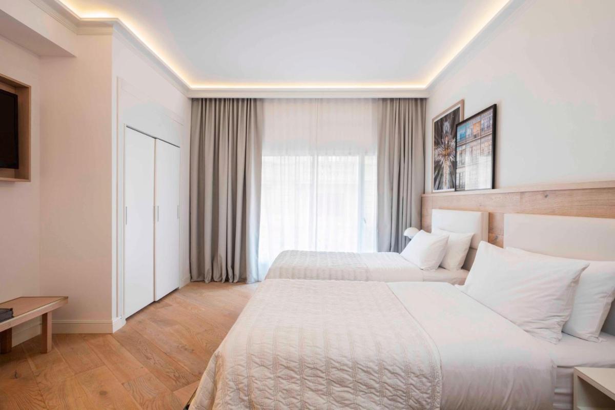 Cama o camas de una habitación en Le Meridien Barcelona