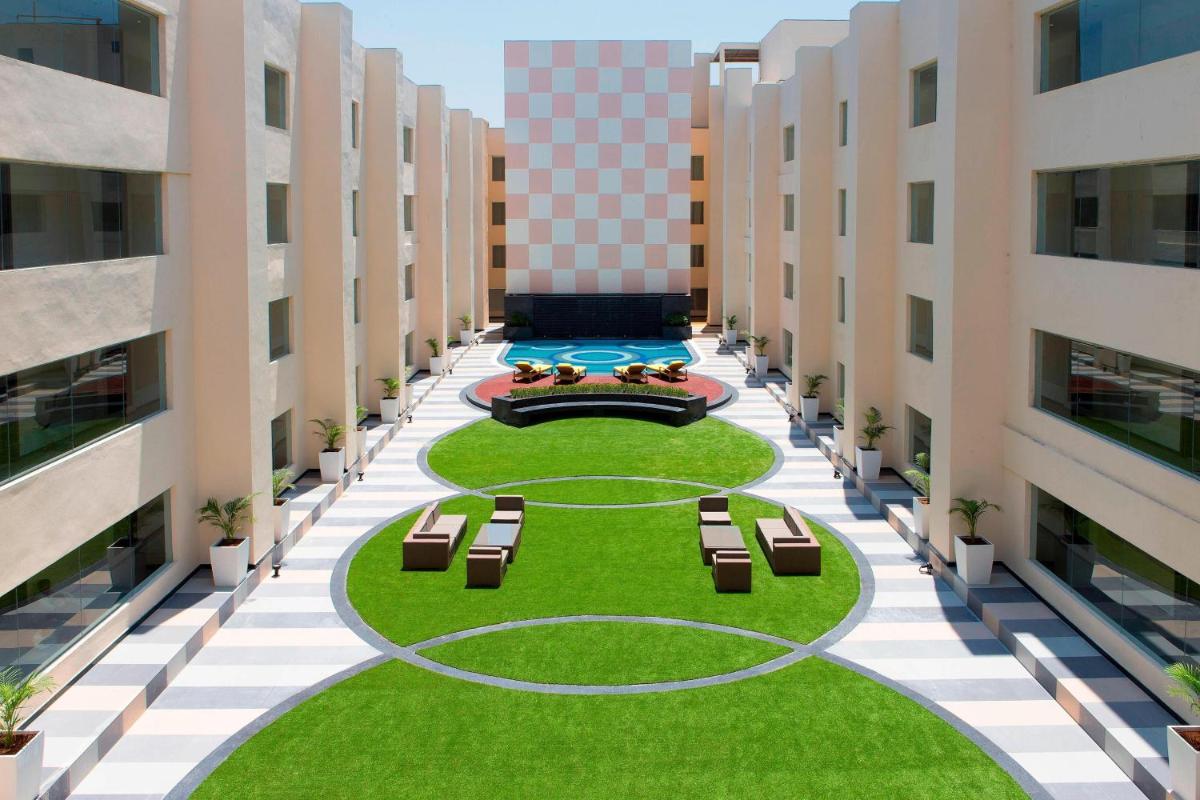 an aerial view of the courtyard of an apartment building at Sheraton Hyderabad Hotel in Hyderabad