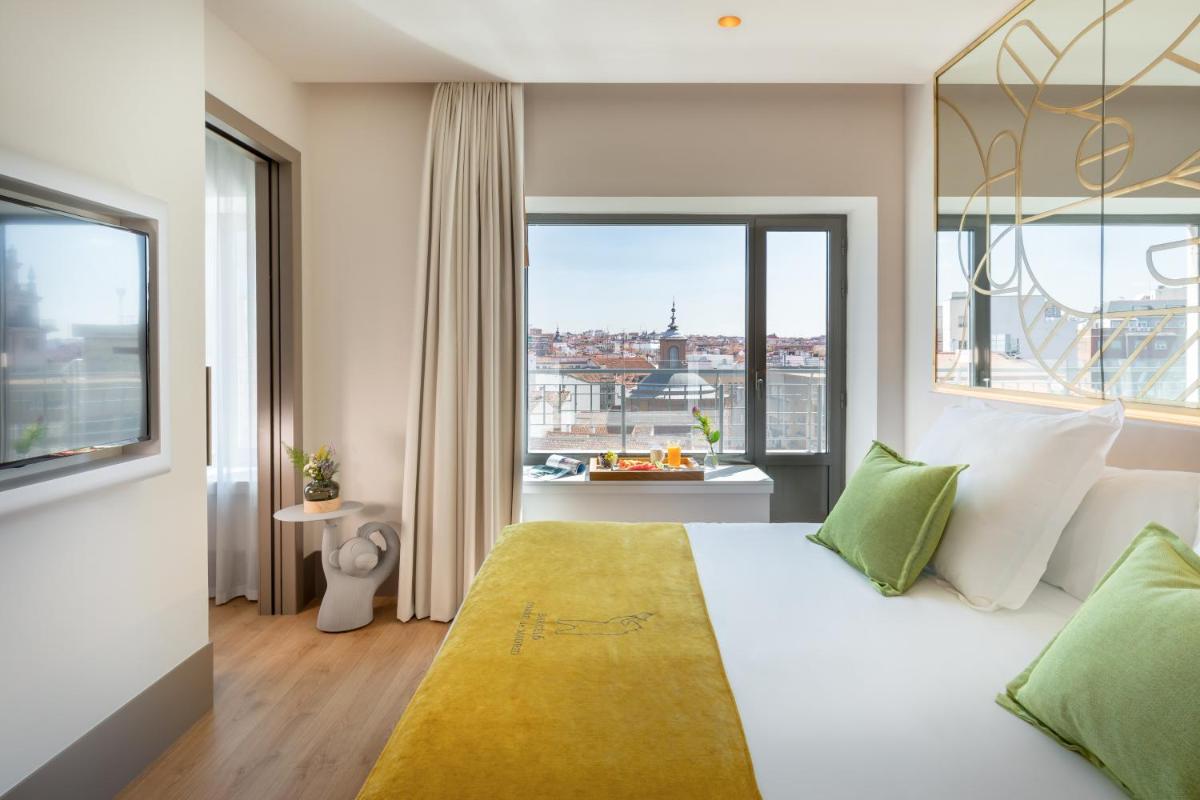 Cama o camas de una habitación en Barceló Torre de Madrid