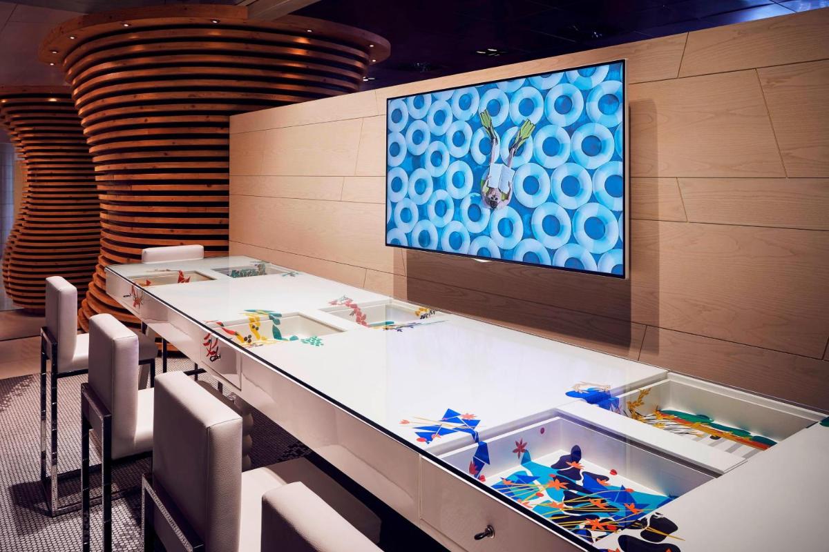 a group of lego tables in a room at Le Meridien New Delhi in New Delhi a group of lego tables in a room at Le Meridien New Delhi in New Delhi