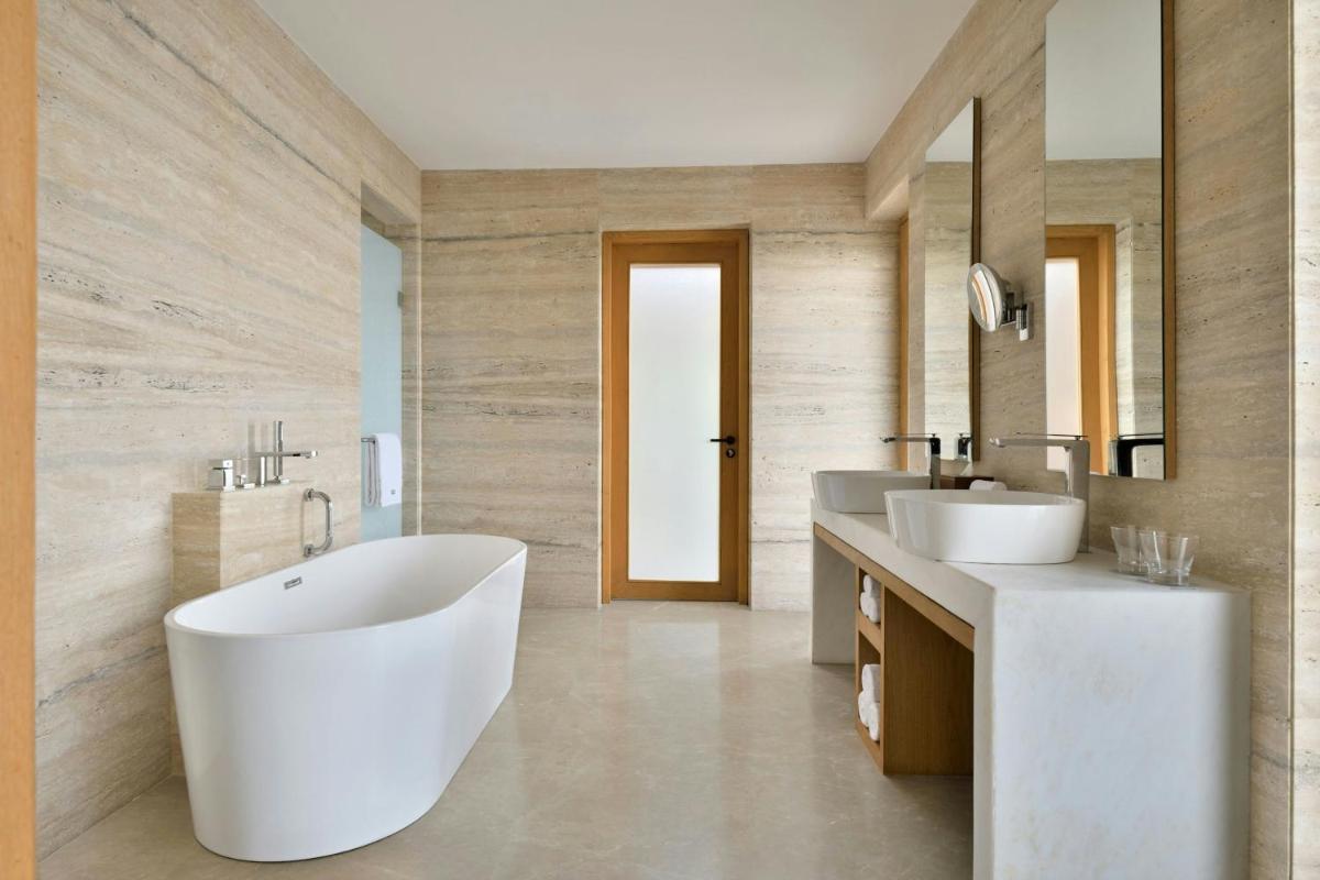 a bathroom with two sinks and a large tub at The Westin Resort & Spa Himalayas in Rishīkesh