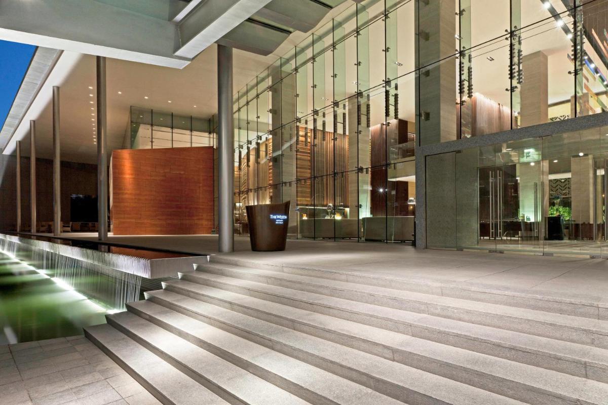 a lobby of a building with glass walls at The Westin Gurgaon, New Delhi in Gurgaon